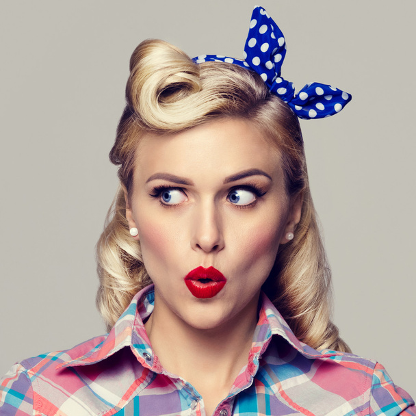  young surprised woman, dressed in pin-up style - Foto, Imagem