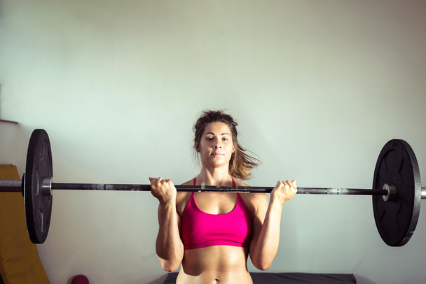 Girl doing weightlifting - Zdjęcie, obraz