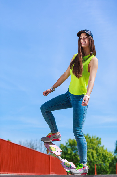 Teen girl skater riding skateboard on street. - Fotoğraf, Görsel