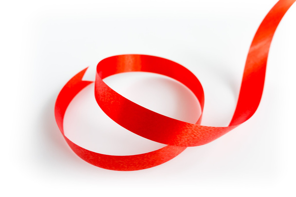 Shiny red ribbon with soft shadow on white background - Фото, изображение