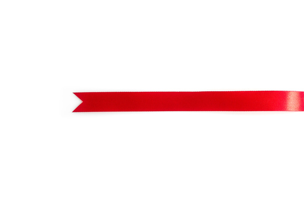 Red ribbon bookmark on white background - Foto, afbeelding