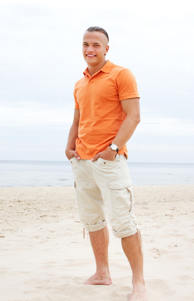 Portrait of man posing on the beach - Photo, image