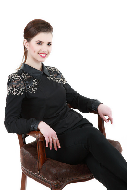 Portrait of young emotional business woman on chair - Zdjęcie, obraz