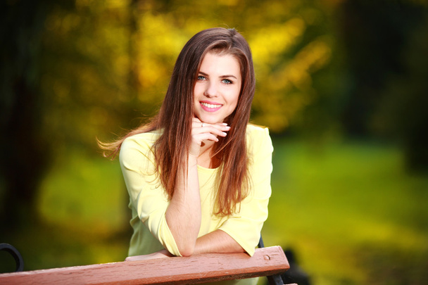 Attractive young woman enjoying her time outside in park - Foto, immagini