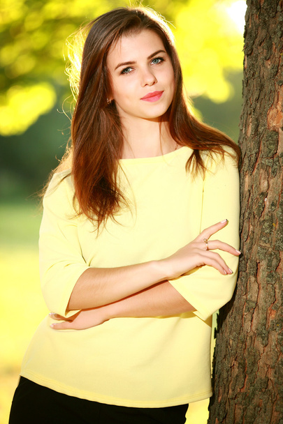 Attractive young woman enjoying her time outside in park - Φωτογραφία, εικόνα