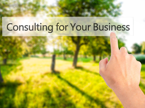 Consulting for Your Business - Hand pressing a button on blurred - Photo, Image