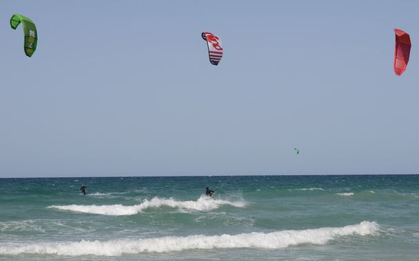 People kitesurfing on the beach of Torre Canne - Photo, image