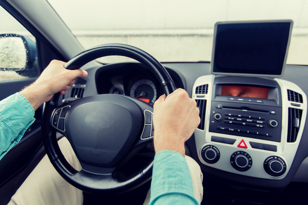 close up of young man with tablet pc driving car - Photo, Image
