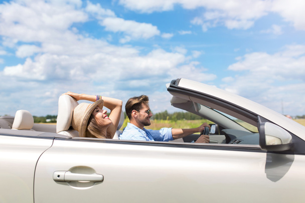 Happy Couple Driving in Convertible - Photo, image