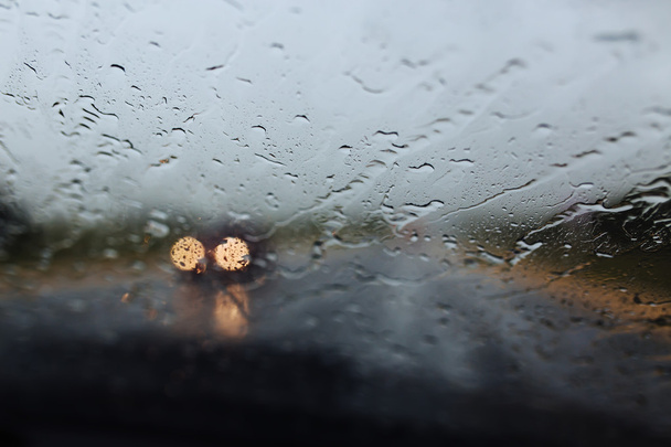 Drive car at heavy rain. Water drops at window - Fotografie, Obrázek