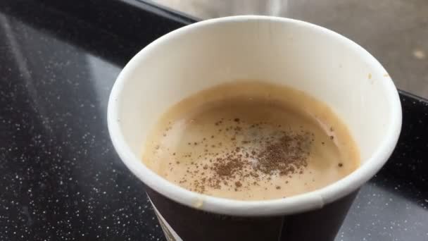 adding cinnamon and sugar in coffee - Záběry, video