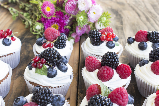 Cupcakes with Fruits on a Rustic Wooden Table - Φωτογραφία, εικόνα