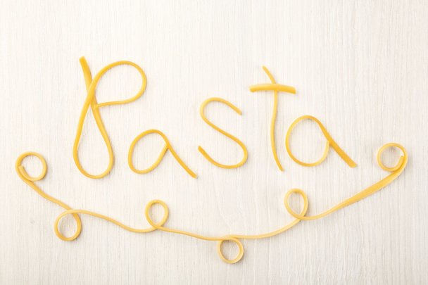 Word PASTA made of cooked spaghetti  - Foto, Imagen