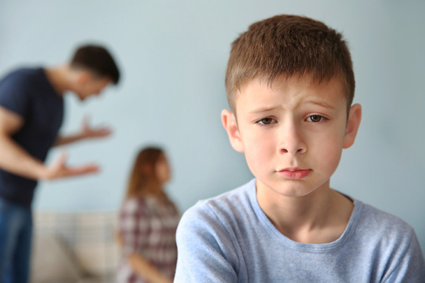 Family problems concept. Sad boy and abusing parents - Valokuva, kuva