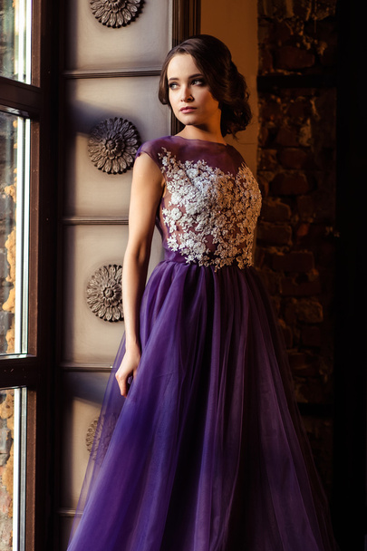 portrait of beautiful elegant young woman in gorgeous evening dress - Fotó, kép