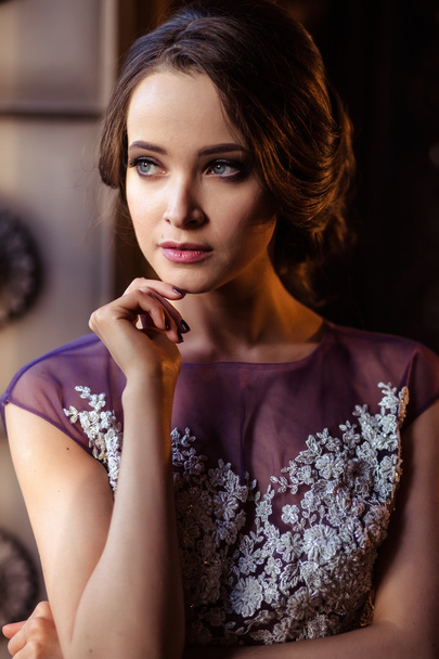 portrait of beautiful elegant young woman in gorgeous evening dress - Fotó, kép