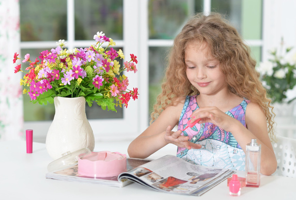 Beautiful little girl reading magazine  - Fotoğraf, Görsel
