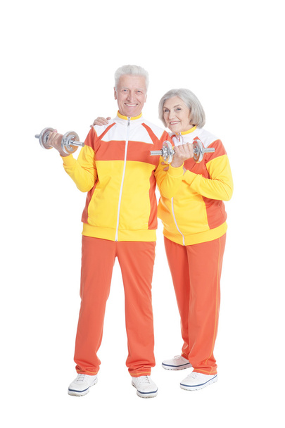 Senior Couple Exercising with dumbbells - Photo, image