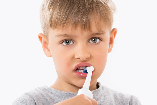 Close-up Of Boy Brushing Teeth - Фото, изображение