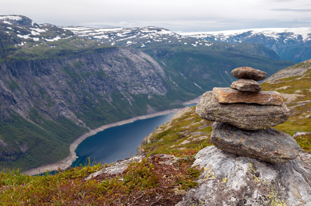 stack of rocks stones with fjord background in the mountains of Norway - 写真・画像