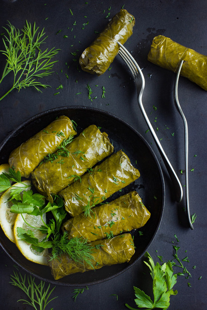 Dolma, stuffed grape leaves with rice and meat - Foto, afbeelding