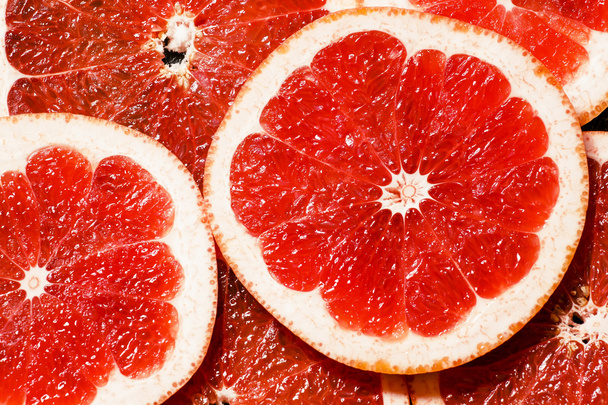 Slices of red grapefruit - Фото, зображення