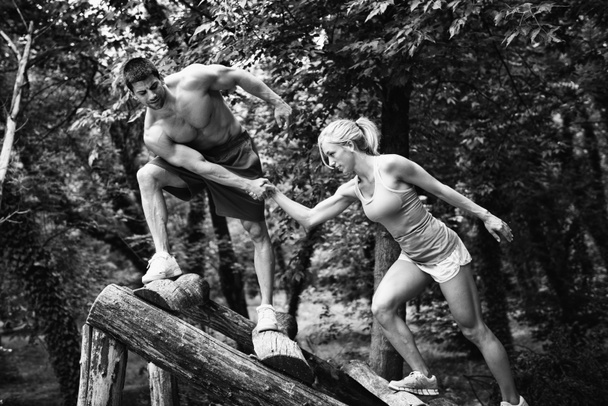 Crossfit couple on obstacle course - Photo, Image