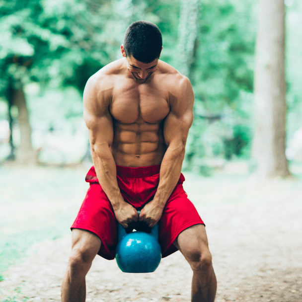 crossfit athlete with kettle bell - Photo, Image