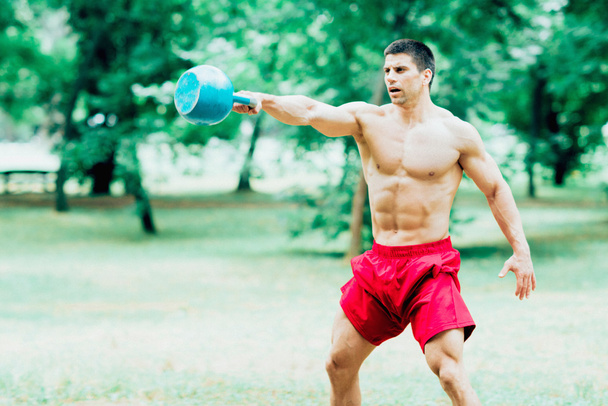 crossfit athlete with kettle bell - Photo, Image