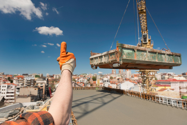 Construction worker gesturing up sign - Photo, Image