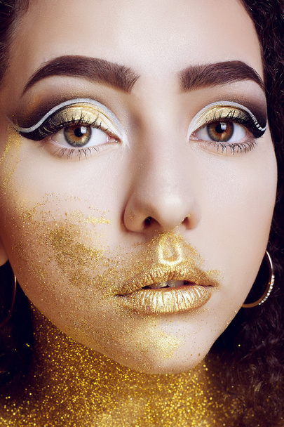 Magic Girl Portrait in Gold. Golden Makeup - 写真・画像