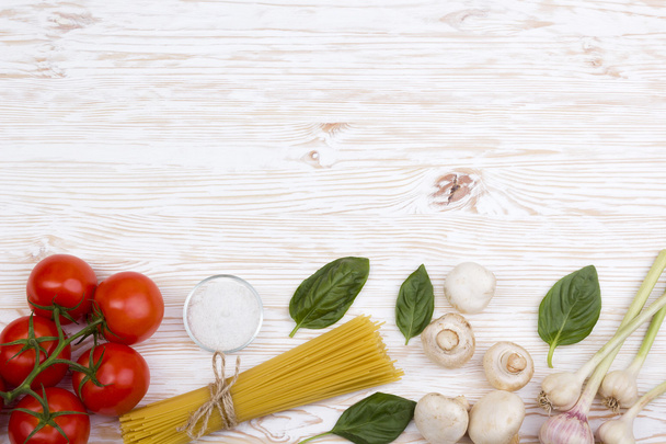 Ingredients. Tomatoes, pasta, garlic, basil, champignon and salt. - Photo, Image