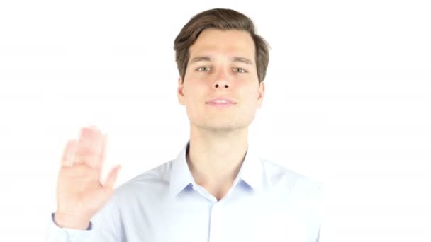 Young man says hello in camera , isolated  white background - Footage, Video