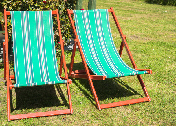 Two folding deck chairs in garden. - Photo, Image