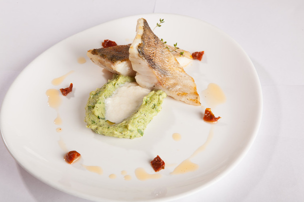 pikeperch with mashed potatoes and cheese sauce on white plate - Photo, Image