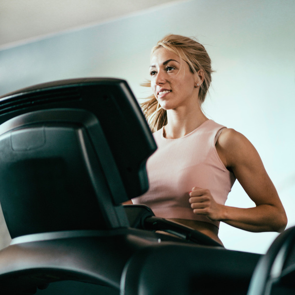 woman jogging on treadmill - Photo, Image