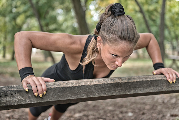 Female athlete doing push ups - Photo, Image