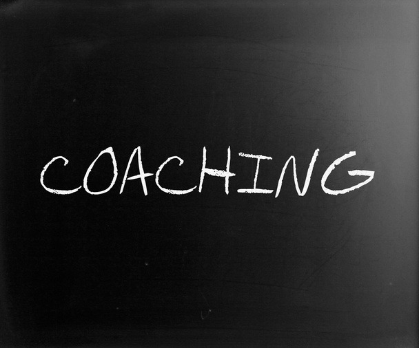 "Coaching "handwritten with white chalk on a blackboard
 - Фото, изображение
