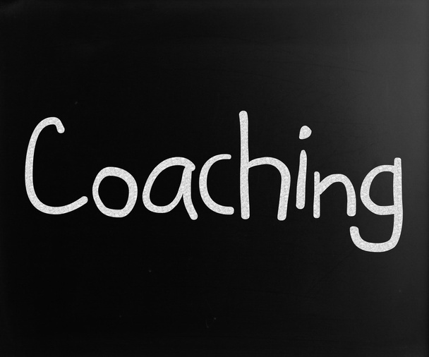 "Coaching "handwritten with white chalk on a blackboard
 - Фото, изображение
