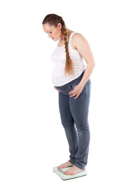 Pregnant woman, scales, isolation - Photo, Image