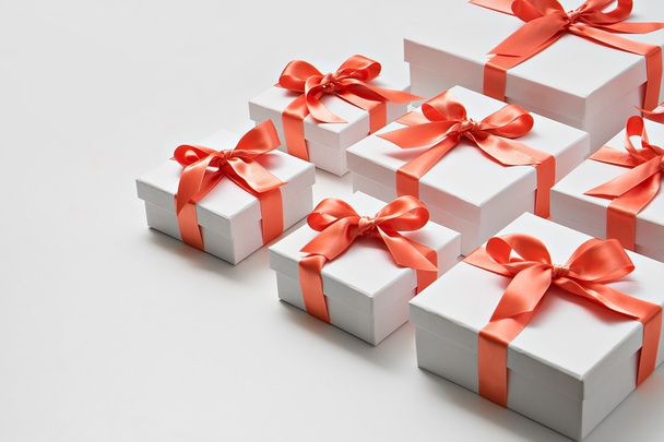 gifts.  white boxes with orange ribbon - Фото, изображение