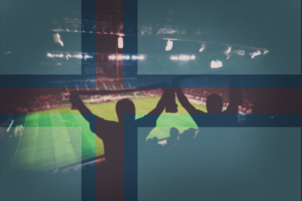 стадион с болельщиками и смешиванием флага Фарерских островов
 - Фото, изображение
