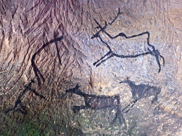 Чорна вуглецева фарба полювання людини на пісковиковій стіні
,  - Фото, зображення