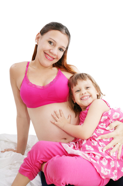 Hermosa mujer embarazada con su hija
 - Foto, imagen