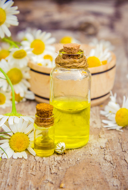 extract of chamomile in a small bottle milking cosmetics and treatment - Fotoğraf, Görsel
