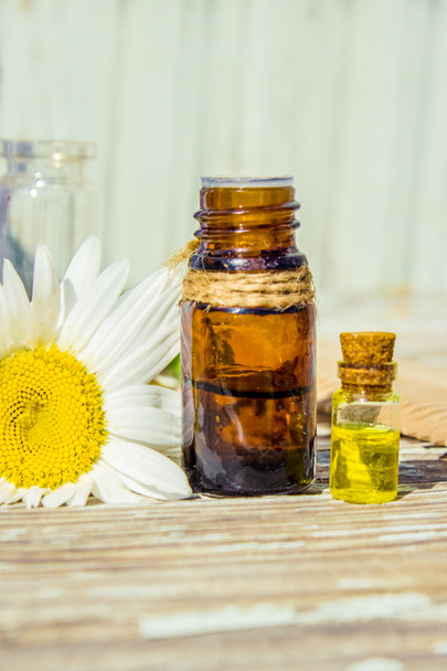 extract of chamomile in a small bottle milking cosmetics and treatment - Photo, Image