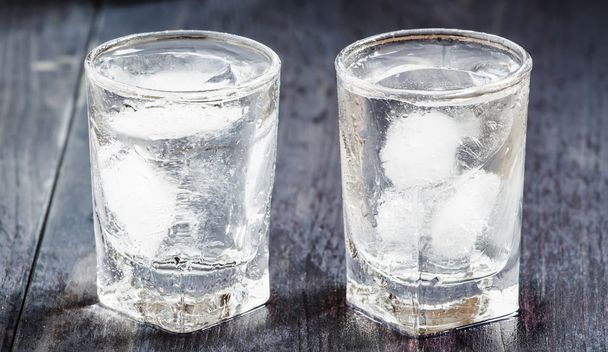 Cold fresh water with ice in a glasses - Фото, зображення