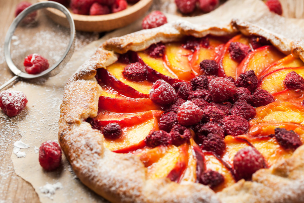 Rustic open pie with peach and raspberry - Photo, Image