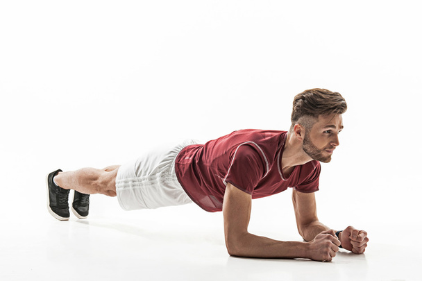 Confident strong man doing push-up - Foto, afbeelding