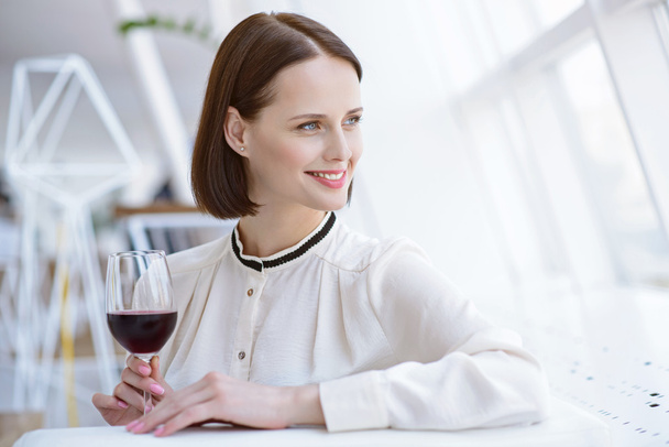 Elegant businesswoman relaxing in cafe - Photo, image